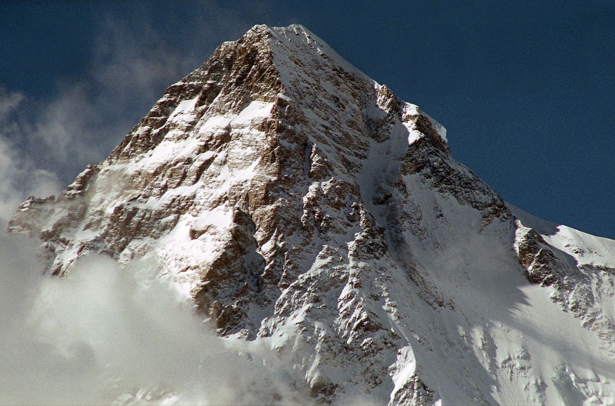 08 K2 Close Up From Concordia Afternoon The K2 West Face shines in the late afternoon sun from Concordia. The K2 West Ridge is on the far left. The Southwest Pillar separates the sunny west face from the K2 South Face. The Great Serac is just in shadow to the right below the K2 Summit. The K2 Shoulder is farther down to the right, partially in the sun. The K2 West Ridge was first climbed by Japanese Eiho Otani and Pakistani Nazir Sabir, reaching the K2 summit on August 7, 1981.